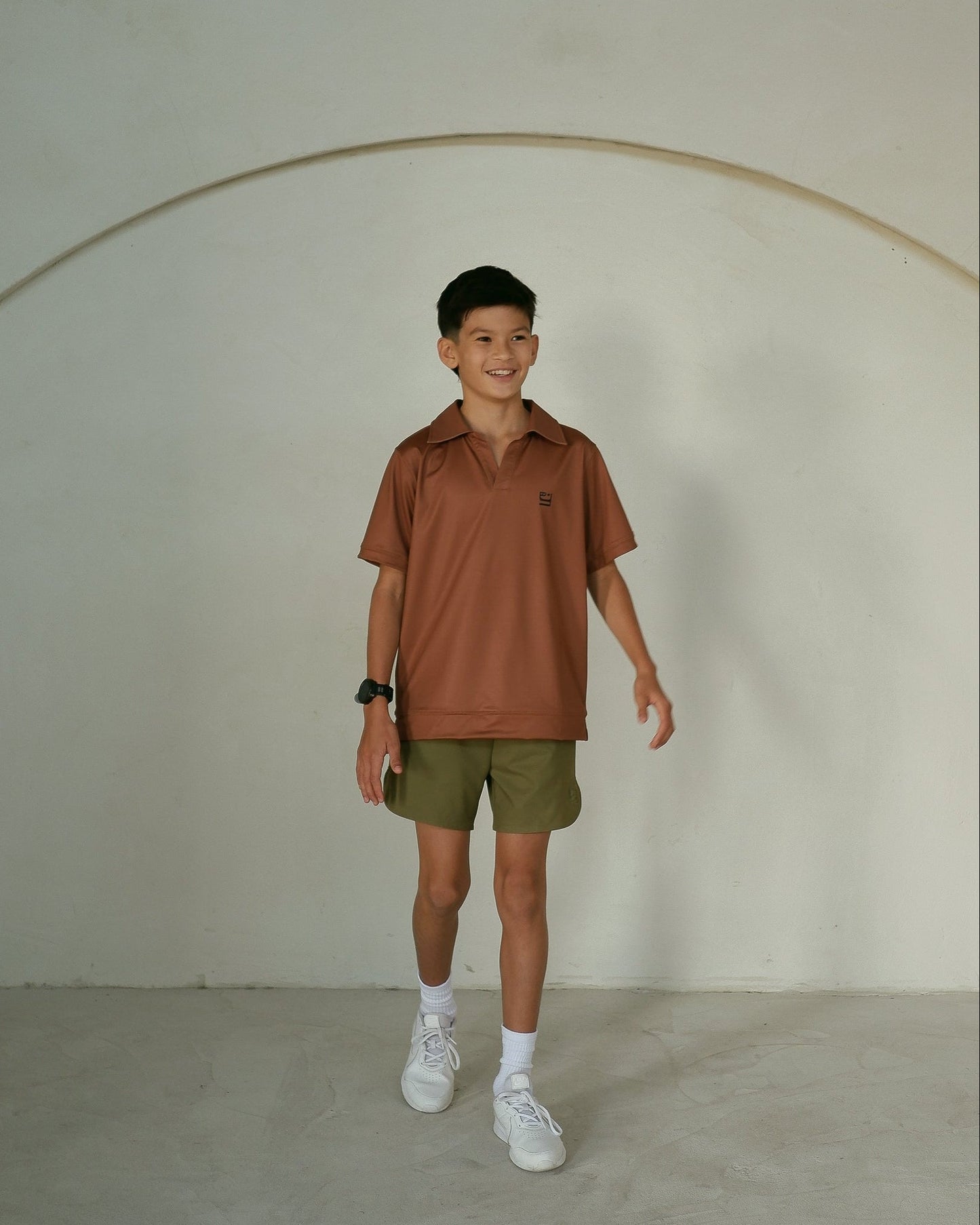 young teenage boy in an active polo